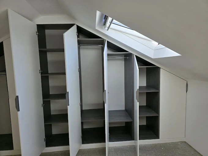 Fitted wardrobes built into loft eaves