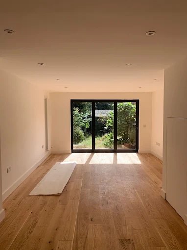 Extension with sliding doors and engineered wood flooring
